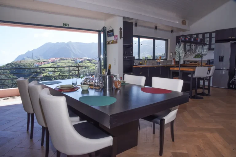 Table with views of the green mountains at Villa da Rochinha